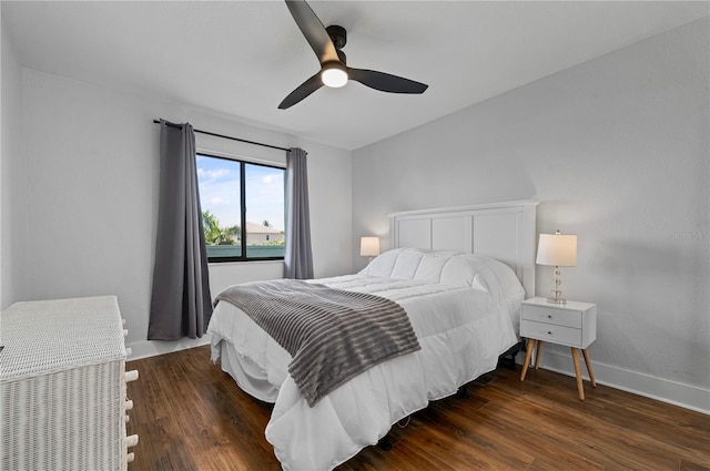 bedroom featuring ceiling fan and dark wood-type flooring