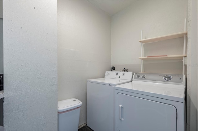 laundry area with independent washer and dryer