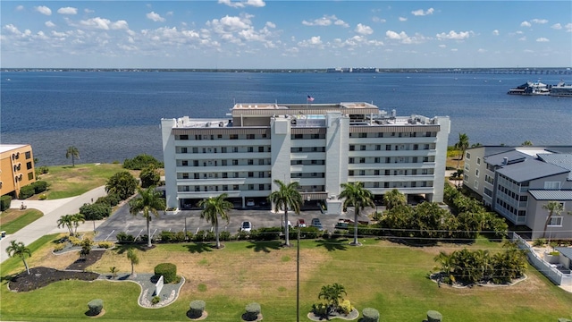 birds eye view of property featuring a water view