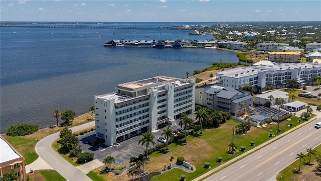 birds eye view of property with a water view