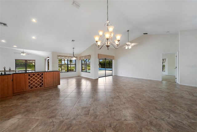 unfurnished room with ceiling fan with notable chandelier, sink, and high vaulted ceiling