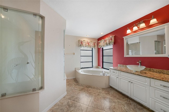 bathroom with vanity and separate shower and tub