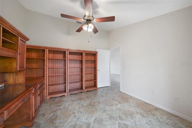 interior space with ceiling fan