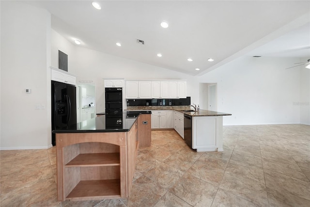 kitchen with a center island, backsplash, white cabinets, sink, and ceiling fan