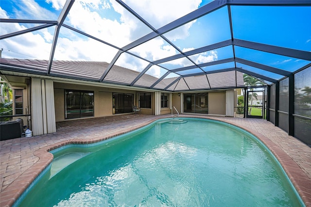 view of pool featuring a patio area and a lanai