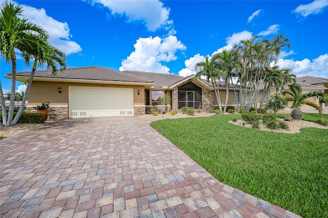 single story home with a front yard and a garage