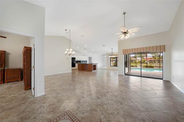 unfurnished living room featuring high vaulted ceiling and ceiling fan