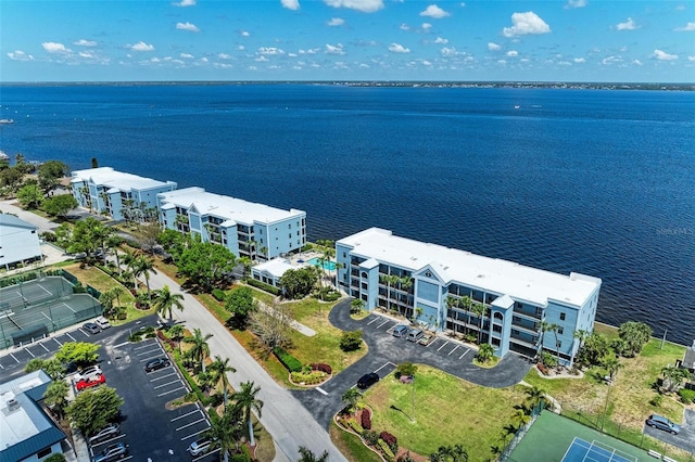 birds eye view of property with a water view