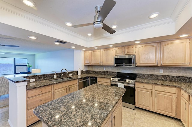 kitchen with light brown cabinets, sink, appliances with stainless steel finishes, and dark stone counters