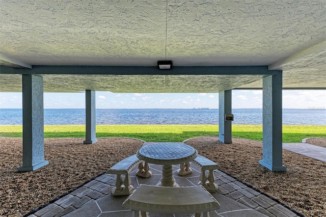 view of patio / terrace with a water view