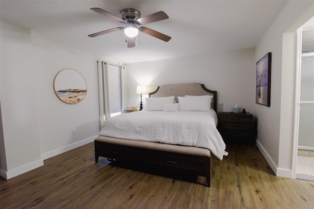 bedroom with ceiling fan and wood-type flooring