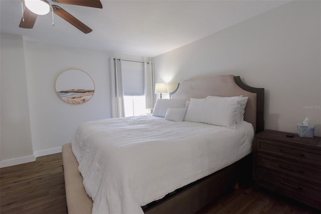 bedroom with ceiling fan and dark hardwood / wood-style flooring