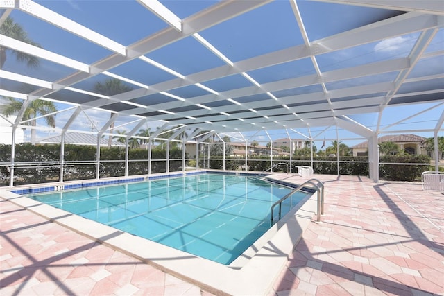 view of pool featuring a patio area and a lanai