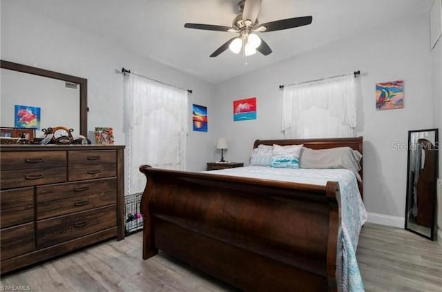 bedroom featuring light hardwood / wood-style flooring and ceiling fan