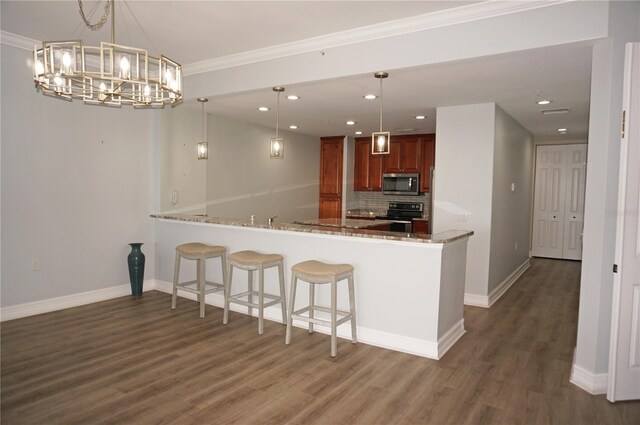 kitchen with kitchen peninsula, pendant lighting, black electric range, and ornamental molding