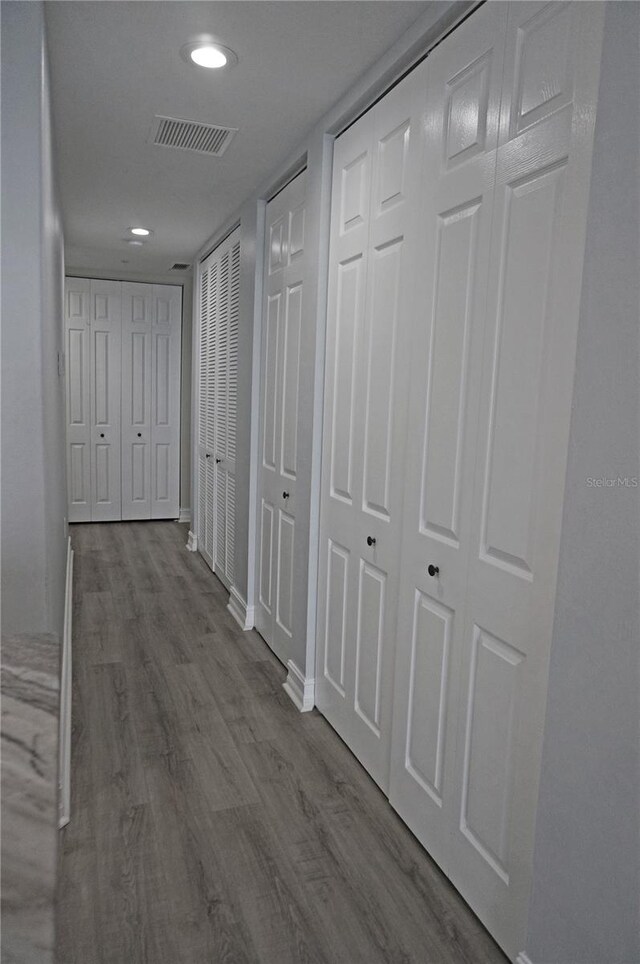 hallway featuring wood-type flooring