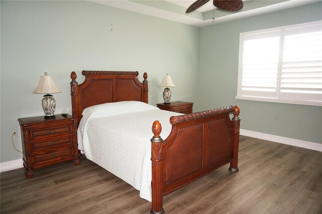 bedroom with ceiling fan and dark wood-type flooring