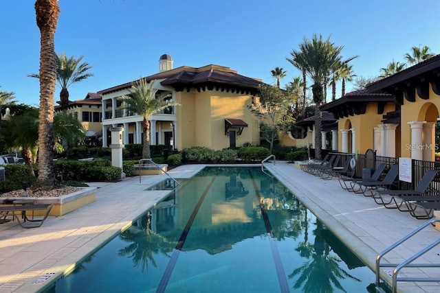 view of swimming pool with a patio area