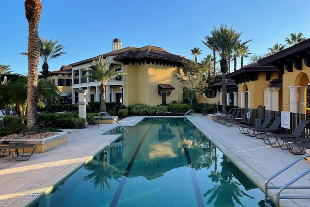 view of swimming pool with a patio area