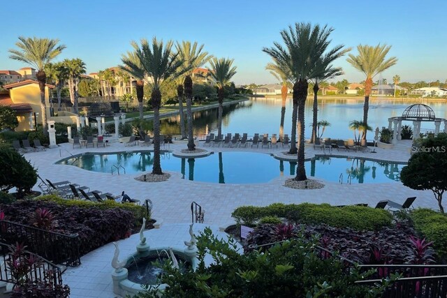 view of pool featuring a water view