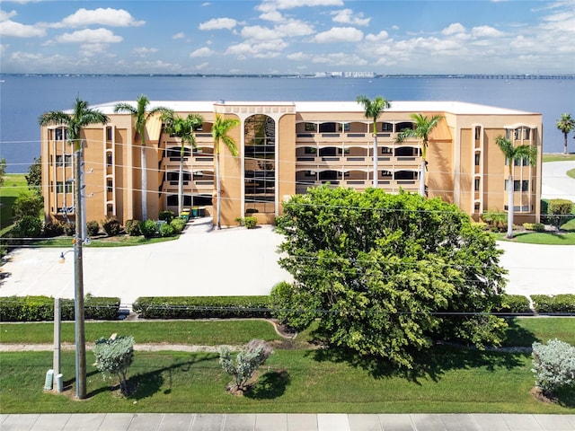 view of building exterior with a water view