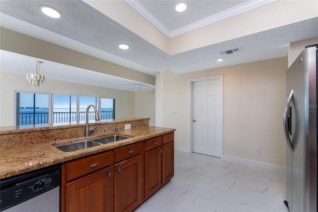 kitchen featuring light stone countertops, appliances with stainless steel finishes, crown molding, sink, and a chandelier