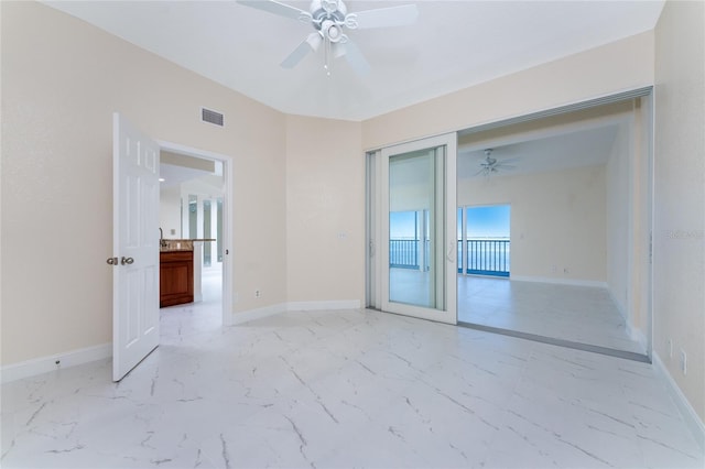 unfurnished room with ceiling fan