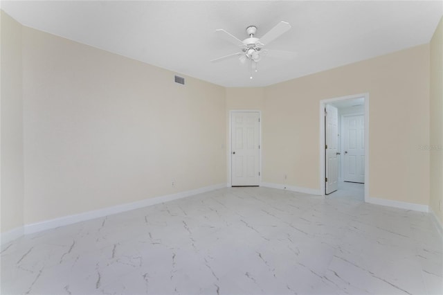 spare room with ceiling fan