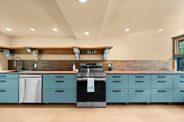 kitchen with open shelves, stainless steel appliances, recessed lighting, a sink, and blue cabinets