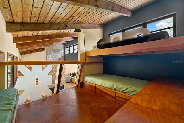 unfurnished bedroom with beam ceiling and wood ceiling