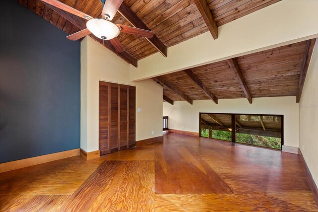 unfurnished living room featuring high vaulted ceiling, wooden ceiling, wood finished floors, a ceiling fan, and baseboards