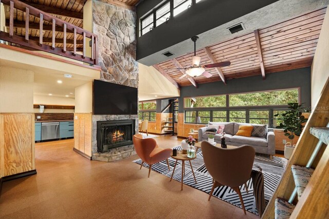 living room featuring beam ceiling, wooden ceiling, and visible vents