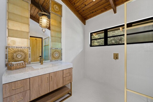 bathroom with vaulted ceiling with beams, wooden ceiling, and vanity