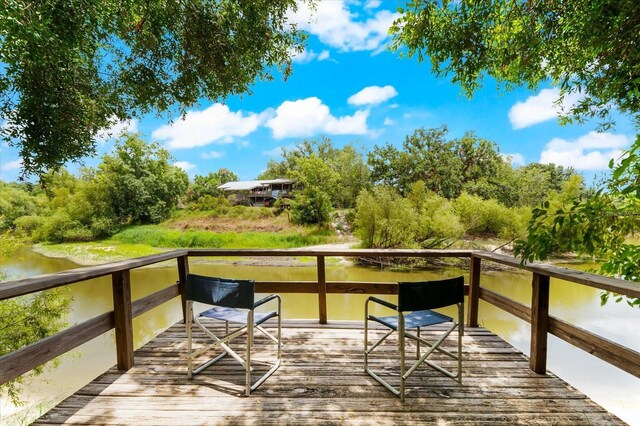 deck featuring a water view