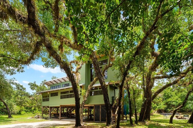 exterior space featuring stairs and a carport