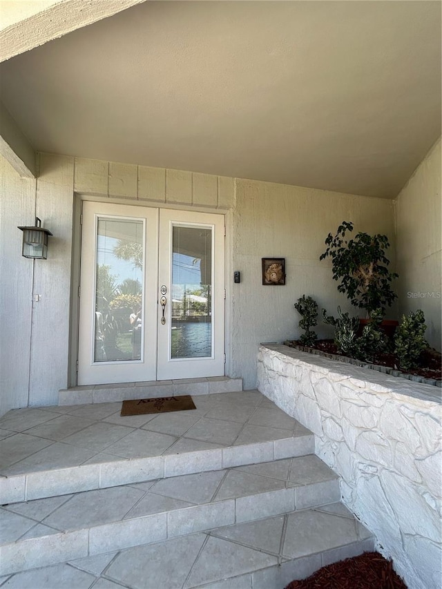 entrance to property featuring french doors