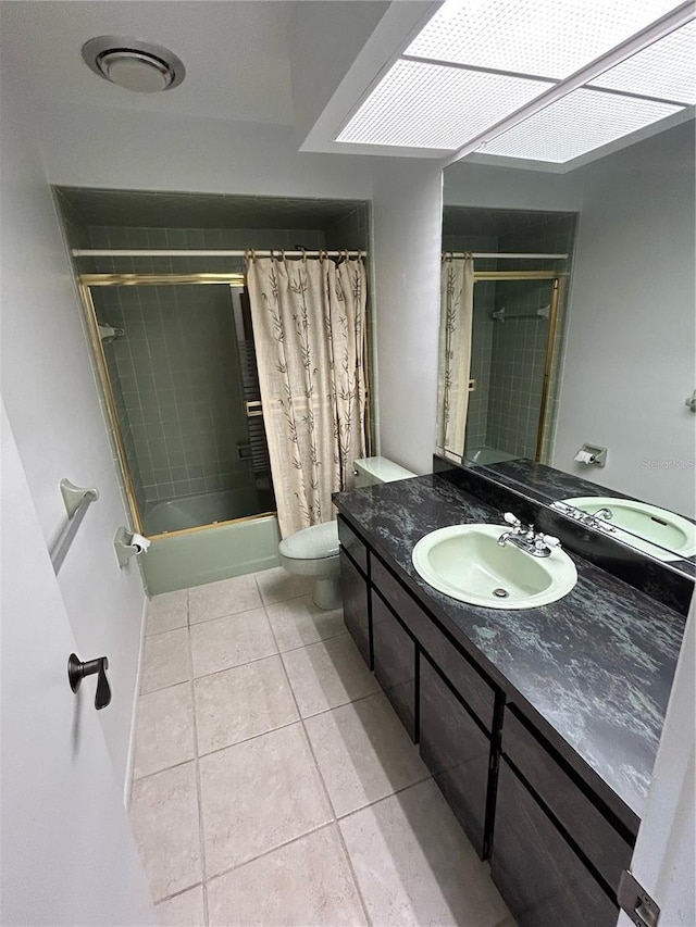 full bathroom featuring tile patterned flooring, vanity, toilet, and shower / bathtub combination with curtain