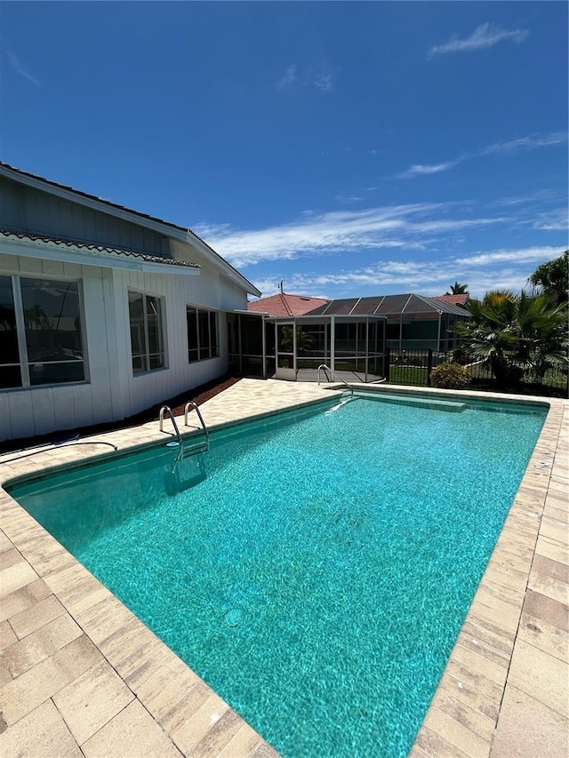 view of swimming pool with a patio