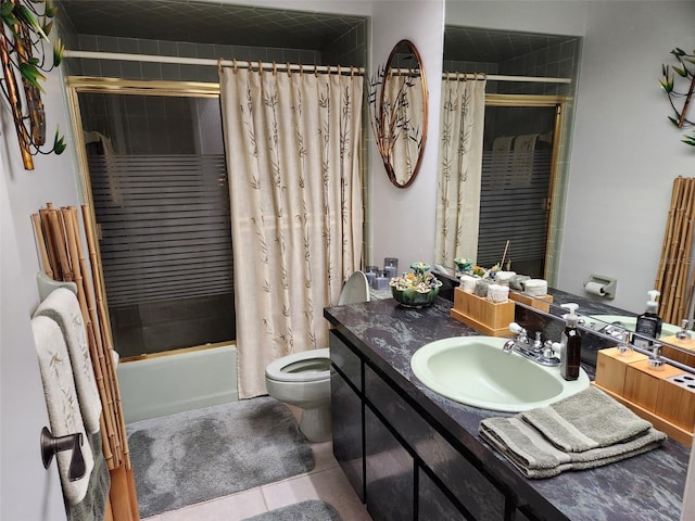 full bathroom featuring tile patterned floors, vanity, toilet, and tiled shower / bath