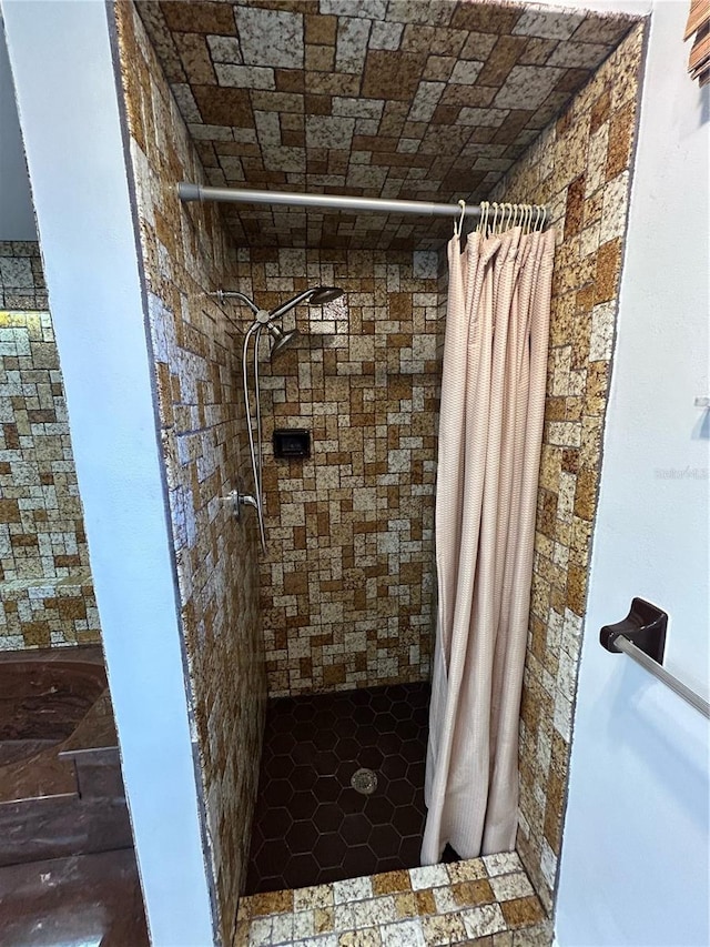 bathroom with a shower with shower curtain