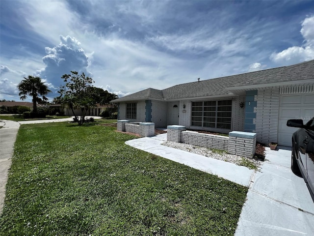 exterior space featuring a yard and a garage