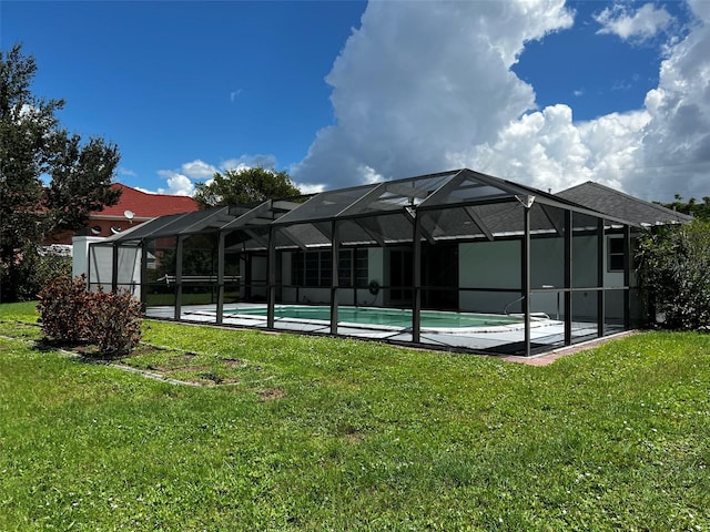 exterior space with a lanai and a lawn