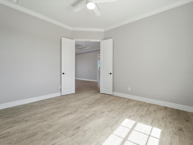 empty room featuring ceiling fan, ornamental molding, and light hardwood / wood-style flooring