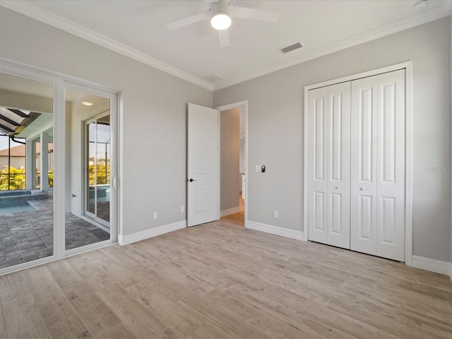 unfurnished bedroom with a closet, ornamental molding, access to exterior, ceiling fan, and light hardwood / wood-style flooring