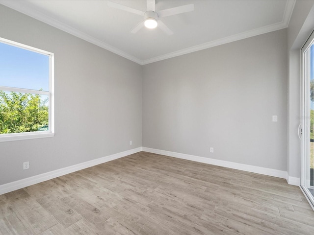 empty room featuring light wood-type flooring, ceiling fan, and crown molding