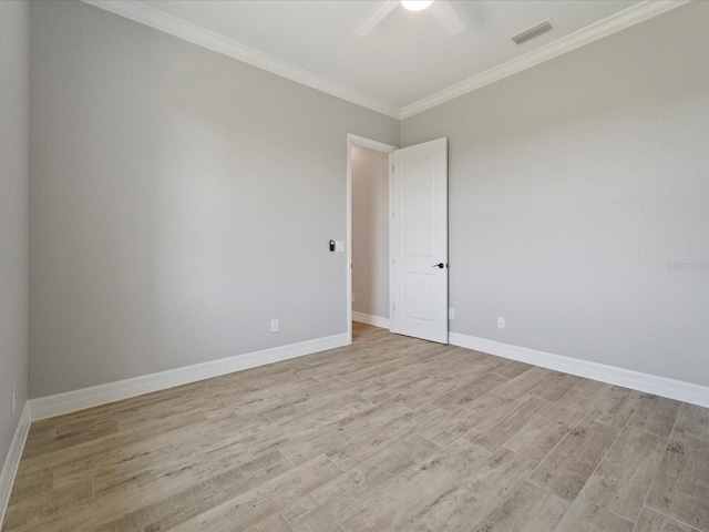 unfurnished room with ceiling fan, light hardwood / wood-style floors, and ornamental molding