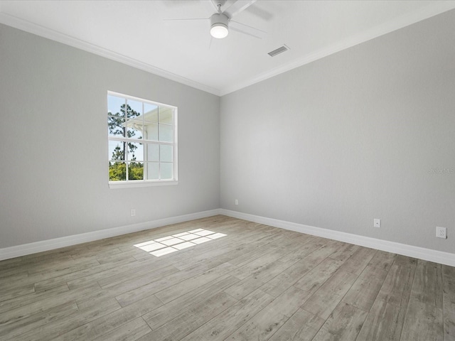 empty room featuring ceiling fan, ornamental molding, and light hardwood / wood-style flooring