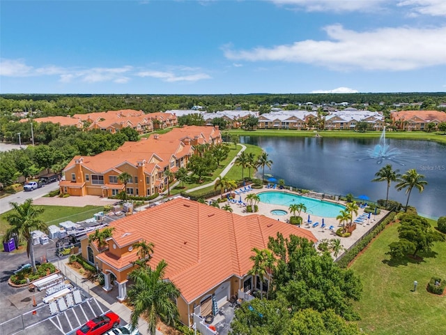 birds eye view of property featuring a water view