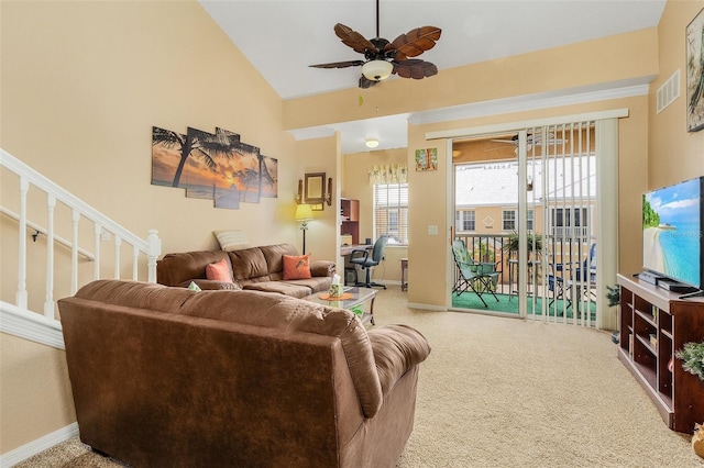 living room featuring lofted ceiling, ceiling fan, and carpet