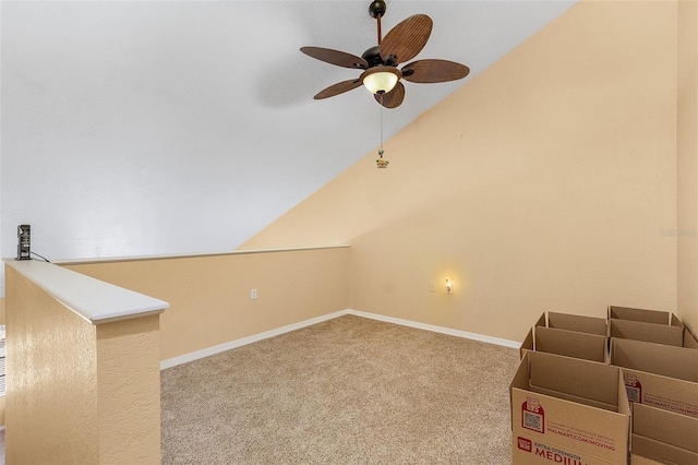 additional living space featuring vaulted ceiling, carpet floors, and ceiling fan